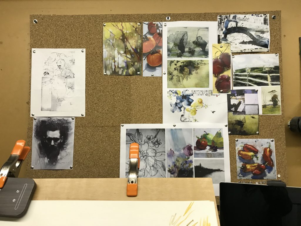 Image of the corkboard in my studio covered with inspiration and creative thought starters