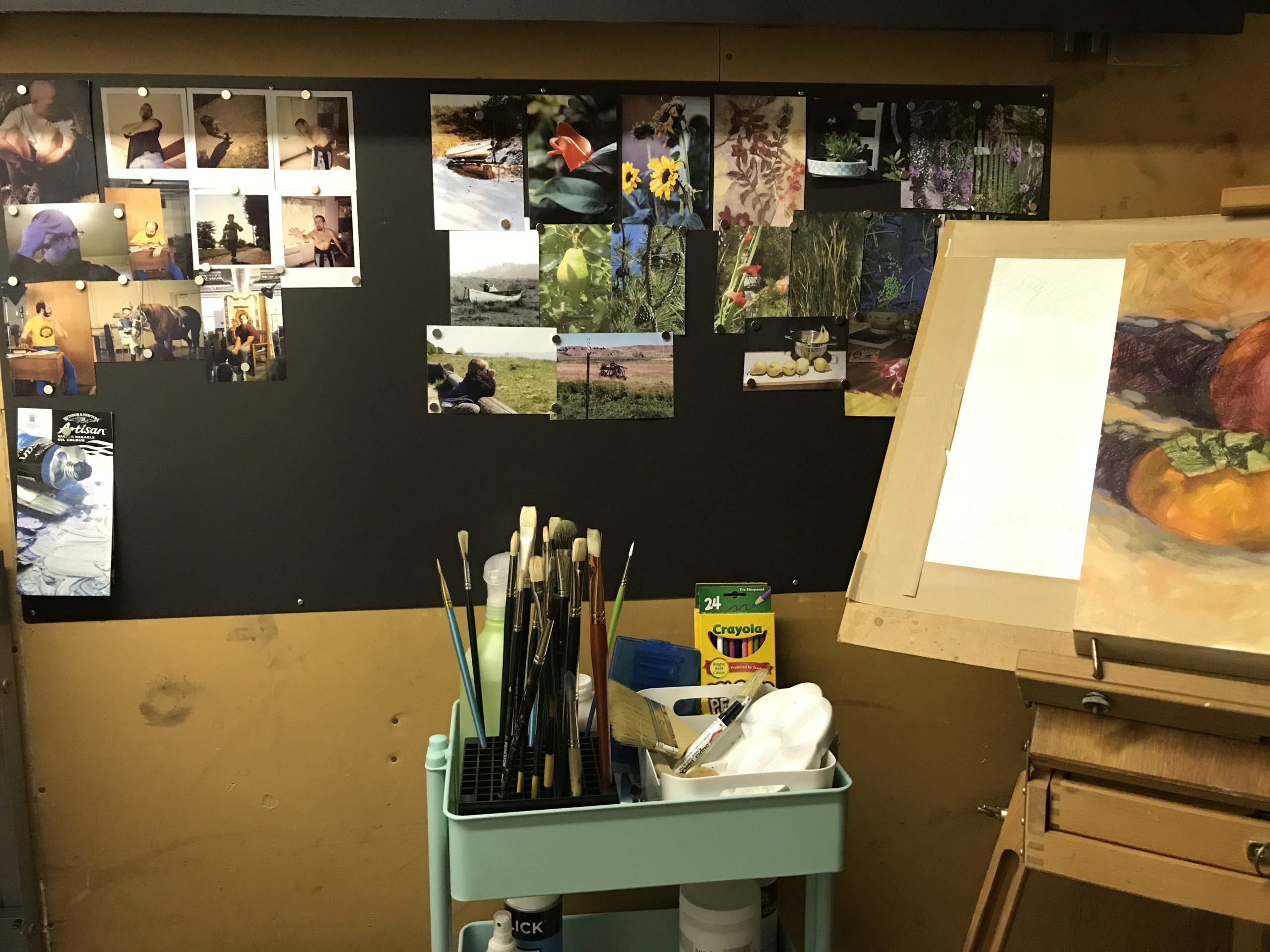 Image of my working studio with reference on the magnet board